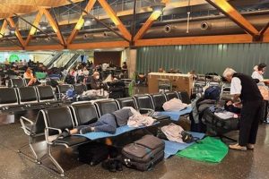 …while Auckland Airport scrambles to clear “huge backlog” of international passengers